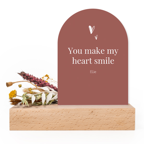 Wooden block with dried flowers and arched forex card