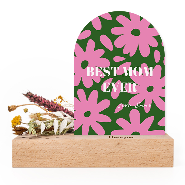 Wooden block with print, dried flowers and arched forex card
