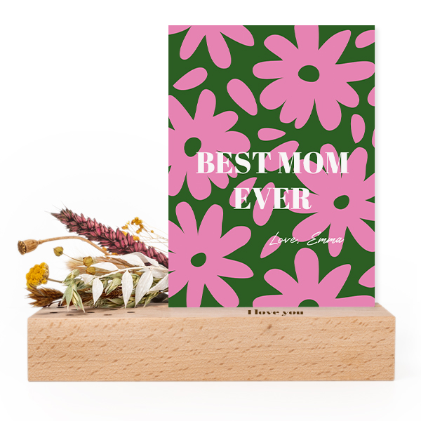 Wooden block with print, dried flowers and forex card