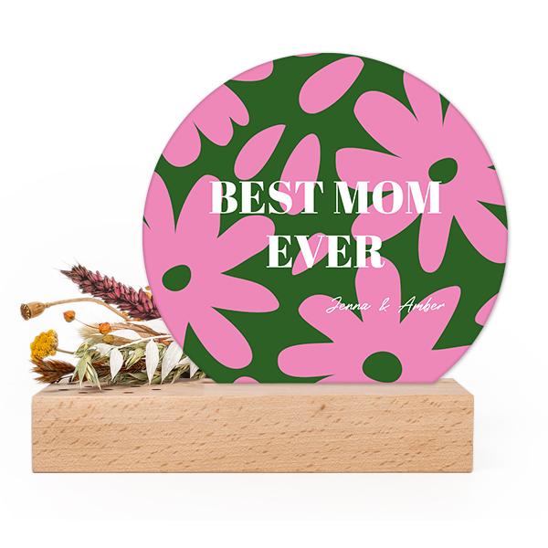 Wooden block with dried flowers and round forex card