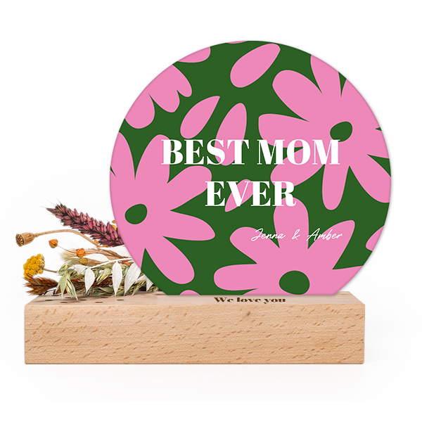 Wooden block with print, dried flowers and rounded forex card