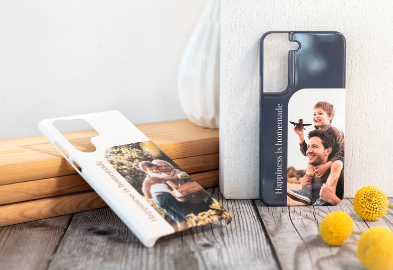 Custom Samsung phone cases with personal photos and text; one white, one navy blue.