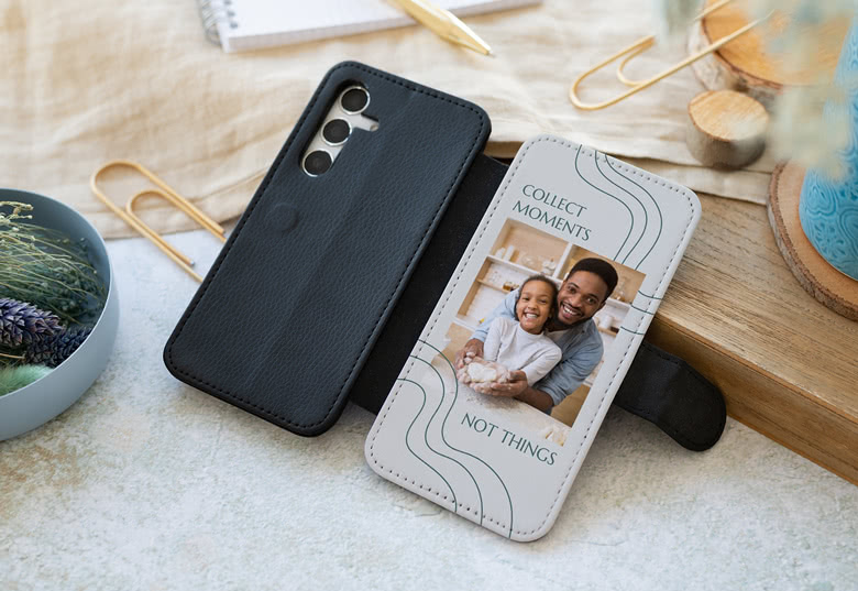 Black Samsung wallet case with personalised photo and "COLLECT MOMENTS NOT THINGS" text.